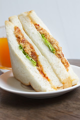 Sandwich with shredded pork and chili paste.