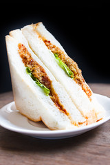 Sandwich with shredded pork and chili paste.