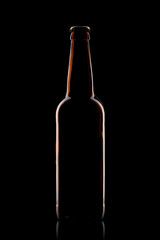 Beer bottle isolated on black