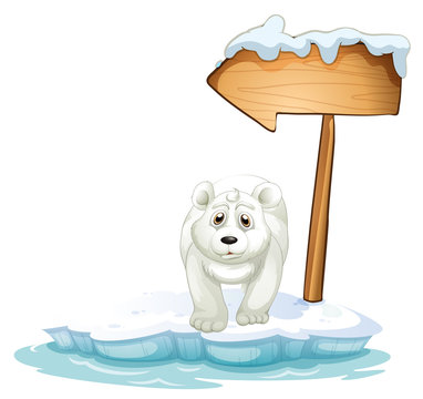 A polar bear below the wooden arrowboard
