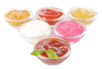 Various sauces isolated on white