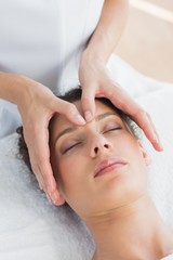 Obraz na płótnie Canvas Woman having head massage in spa