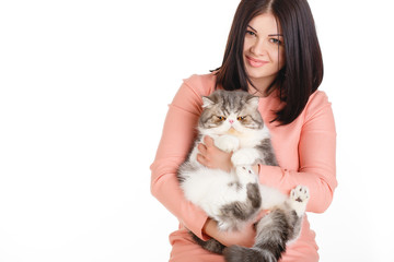 beautiful smiling brunette girl and her big cat on a white 