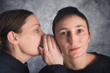 Two women gossiping