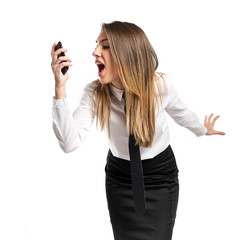 Girl talking to mobile over isolated background.