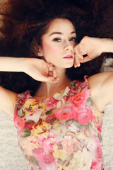Naklejka premium Portrait of beautiful girl with curly hair