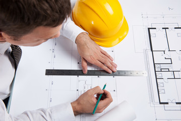 professional architect drawing construction plan.
