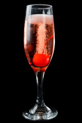 Pink champagne with maraschino cherry