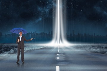 Fototapeta na wymiar Composite image of peaceful businessman holding blue umbrella