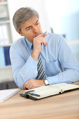 Businessman with worried expression on his face