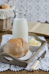 Fresh homemade bread rolls with milk