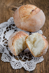 Homemade fresh buns bread on old wooden table