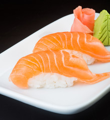japanese cuisine. sushi salmon on the background