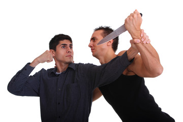 Man defending himself against a knife attack