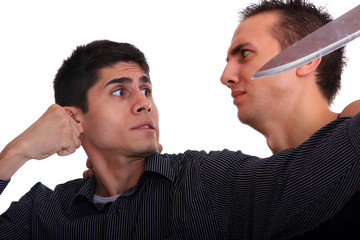 Man defending himself against a knife attack