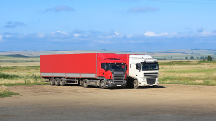 trucks on parking against landscape