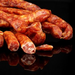thin sausage on a black background