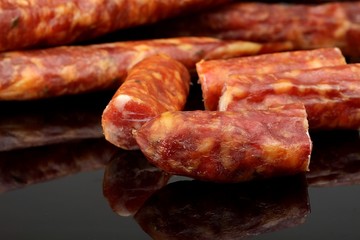thin sausage on a black background
