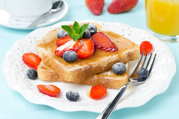 crispy toast with honey, fresh berries, coffee and orange juice
