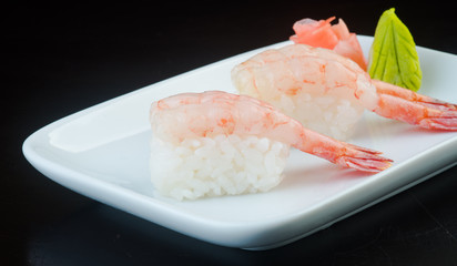 japanese cuisine. sushi shrimp on the background