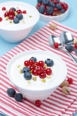 fresh sweet yogurt with berries, top view