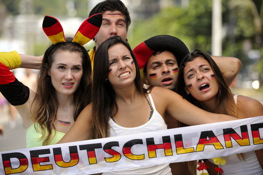 Happy group of astonished German sport soccer fans