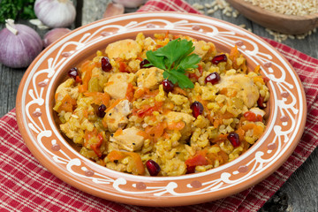pilaf with chicken and vegetables on a plate