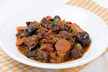 plate of stew with beef and vegetables