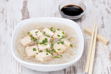 soup with rice noodles, tofu and green onions