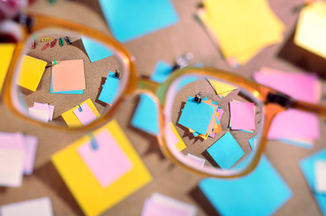 Blank post-its seen through high diopter eyeglasses.