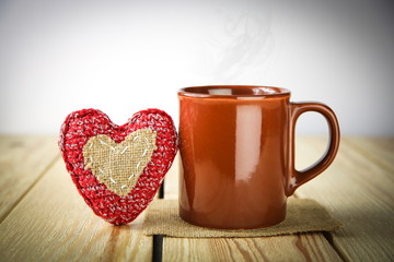 Cup with heart on the table