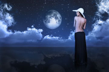 bare woman looking at moon