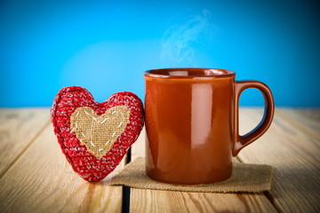 Cup with heart on the table