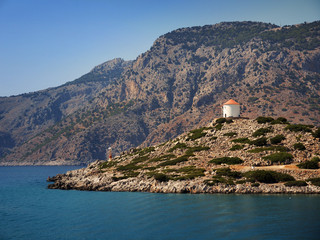 a small mill on the island in Greece - obrazy, fototapety, plakaty