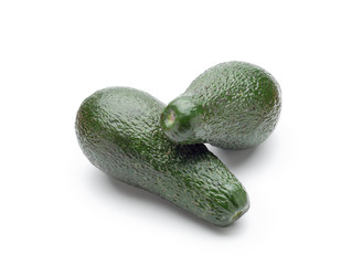 Two green avocados isolated on white background