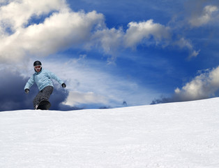 Fototapeta na wymiar Snowboarder on ski slope