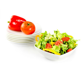 Fresh salad and vegetables in white plates with clipping path