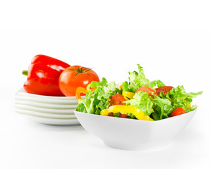 Fresh salad and vegetables in white plates with clipping path