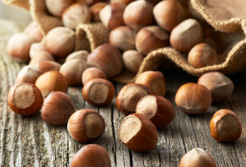 Hazelnuts, filbert on old wooden background