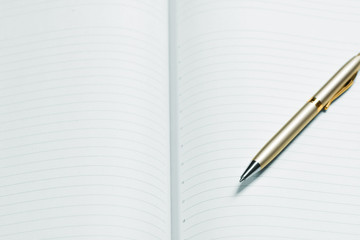 pen and open notepad