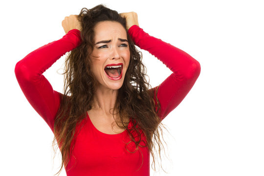 Angry and upset woman screaming and crying. Isolated on white.
