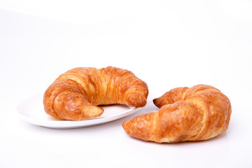 Two croissants on a white background