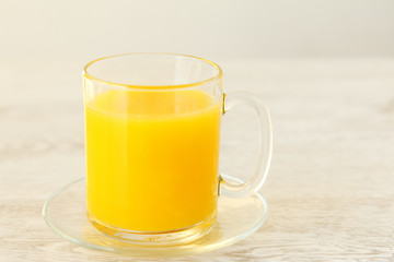 Orange juice in a glass mug