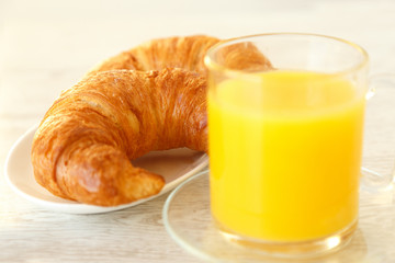 Croissants and a mug of orange juice