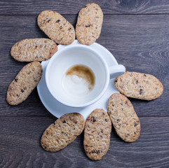 Organic biscuits and a white cup on a table