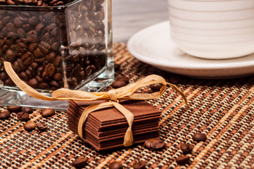 Fototapeta premium Chocolate with a paper ribbon and coffee