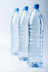 Three bottles of crystal-clear water