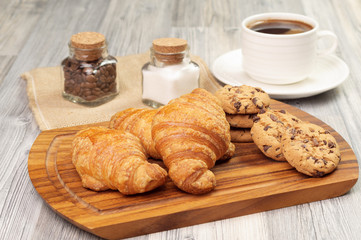 Some pastries and a cup of black coffee