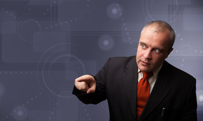 Elegant businessman touching copy space