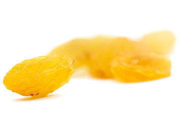 Fototapeta na wymiar Golden raisins on a white background